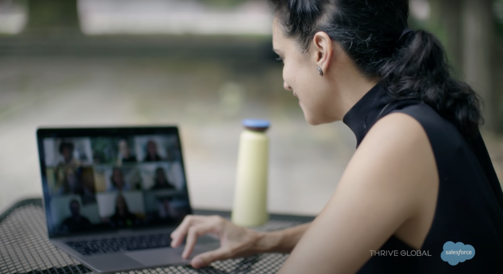 Priya Parker sits facing a laptop and is talking to people in a video call